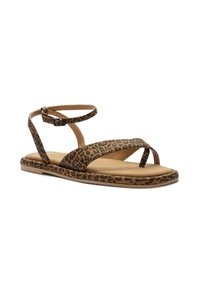 Leopard print flat sandals with a beige base, featuring two straps across the foot and an ankle strap secured with a buckle.