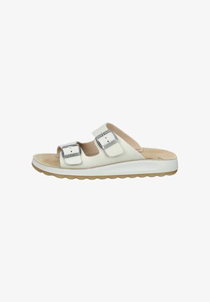 White open-toe slide sandal with two adjustable silver buckles and a contoured beige footbed on a white sole with a light brown tread.