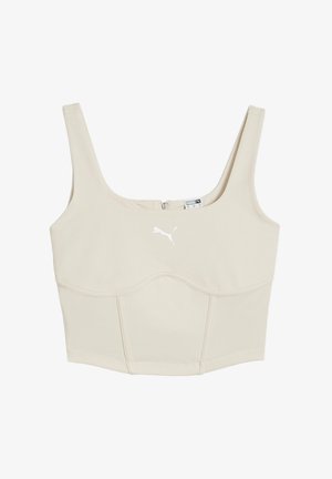 Top sportiv bej, scurt, cu bretele late, fermoar la spate și logo Puma alb în față. Material neted, elastic.