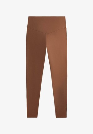 Bruna, figursydda leggings med hög midja, designade för rörelse och komfort. Tillverkade av ett mjukt, andningsbart tyg utan synliga mönster.