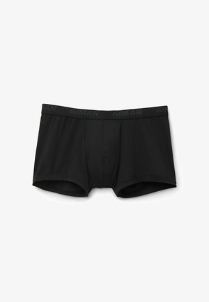 Boxer cortos negros hechos de una tela suave. La cinturilla elástica presenta una sutil marca en un tono más oscuro. Diseño clásico de tronco sin patrones.