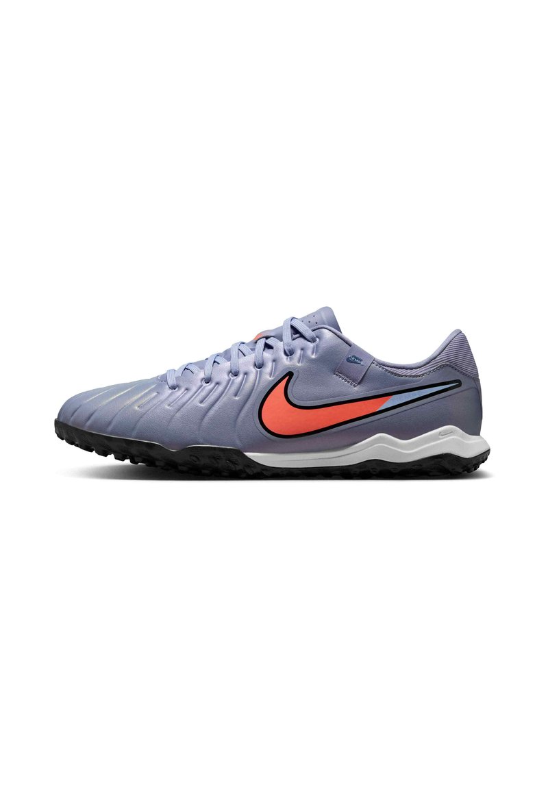 Light purple soccer cleat with textured upper, black outsole, orange Nike swoosh, and grey accents. Features lace-up design for secure fit.