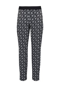 Zwart-wit gestreepte broek met een rekbare tailleband. Bevat een herhalend cirkelontwerp. Slim fit met taps toelopende benen.