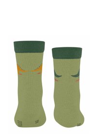 Grüne Socken mit einem gerippten oberen Teil, die verspielte Dinosaurier-Illustrationen in Orange und Dunkelgrün an den Seiten zeigen.