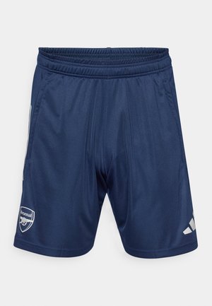 Tumed spordilühikesed, millel on elastne vöökoht, kaks küljetaskut ja Arsenal'i logo. Valmistatud siledast, kergest kangast. Hõbedased detailid.