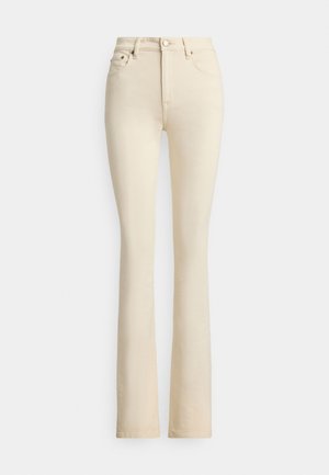 Bēša krāsas izplatītas džinsi ar augstu jostasvietu, divām priekšējām kabatām un pogas aizdari. Gluda tekstūra un minimālas šuvju detaļas.