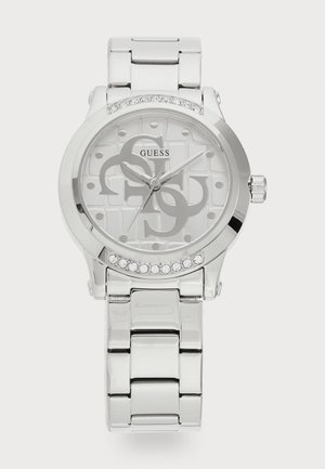 Reloj de metal plateado con una carátula redonda, esfera gris con patrón, marcadores de hora plateados y un bisel adornado con cristales. Diseño de pulsera de eslabones.