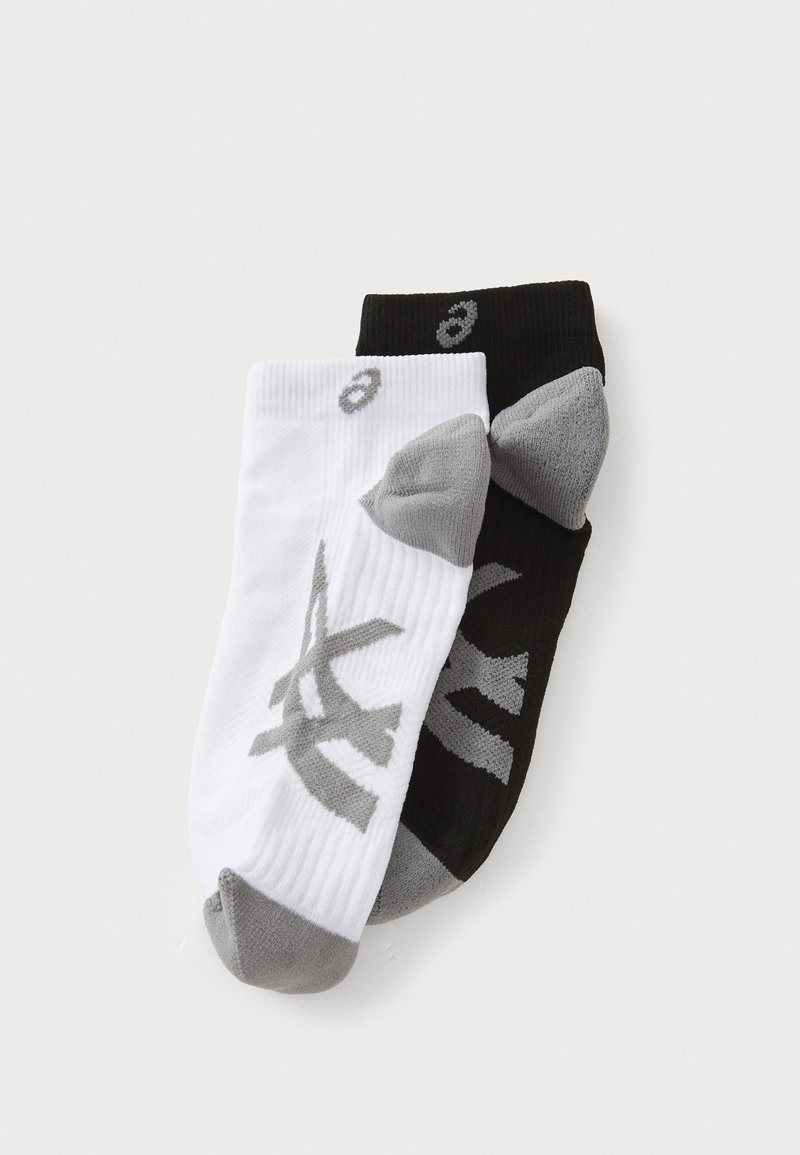 Athletic socks in black and white, featuring gray accents and logo. Ribbed texture with reinforced heel and toe areas, low-cut design.