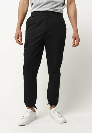 RAJESH - Cargobroek - schwarz