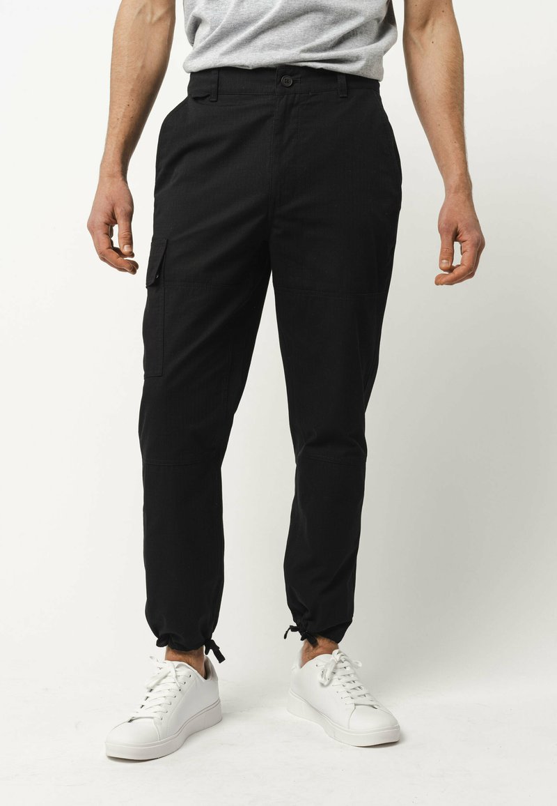 MELA RAJESH - Cargobroek - schwarz