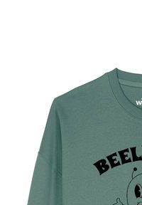 Groene sweatshirt met een ontspannen pasvorm, geribde halslijn en lange mouwen. Voorzien van zwarte grafische tekst en een cartoonontwerp op de voorkant.