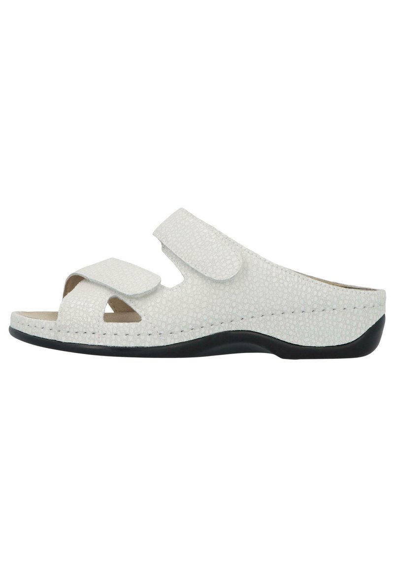White open-toed sandals with a textured synthetic upper, two adjustable Velcro straps, and a black rubber sole. Rounded shape, minimalistic design.