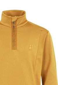 Geel pullover top met een hoge kraag, halve rits en subtiele logodetail. Gemaakt van zachte stof met een gladde textuur.