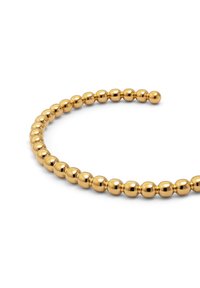 Pulsera de cuentas en tono dorado, que presenta una serie de cuentas redondeadas con una superficie lisa y pulida y un diseño circular abierto.