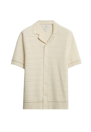 Chemise à manches courtes, crème, avec un col. Présente un motif rayé texturé et un ourlet et des poignets côtelés.
