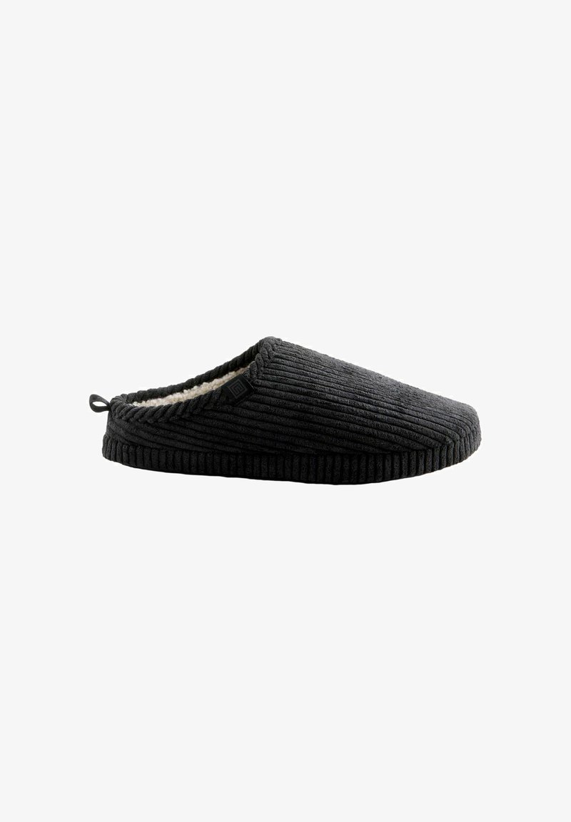 Black corduroy slipper with a textured surface, soft lining, and a loop tab at the heel for easy wear. Features a minimalistic design.
