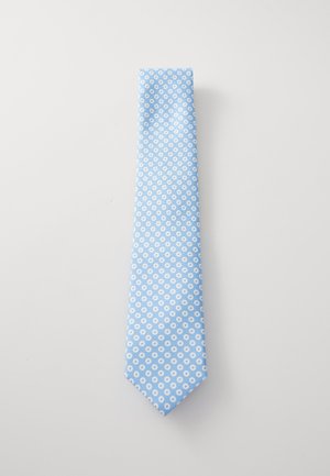 Jasnoniebieski krawat z powtarzającym się białym okrągłym wzorem, gładka faktura, spiczasty koniec i standardowa szerokość. Zaprojektowany do eleganckiego ubioru.