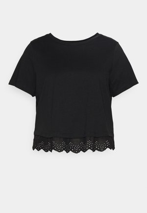Crop top noir à manches courtes avec encolure ronde et ourlet en dentelle festonné avec détails œillets.