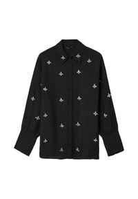 Camicetta nera con colletto, decorata con ricami di api argentate su tutto il tessuto. Realizzata in tessuto leggero, con maniche lunghe e polsini arricciati.
