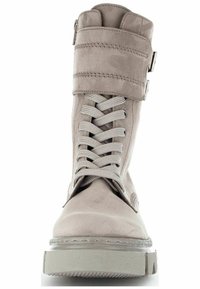 Gray faux suede ankle boot with a lace closure, round toe, and a buckle strap detail. Textured upper and a chunky sole.