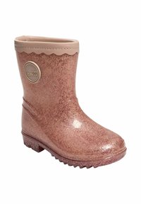Dětská středně vysoká růžová lesklá gumová bota se zvlněným okrajem a kruhovým logem na boku na bílém pozadí.