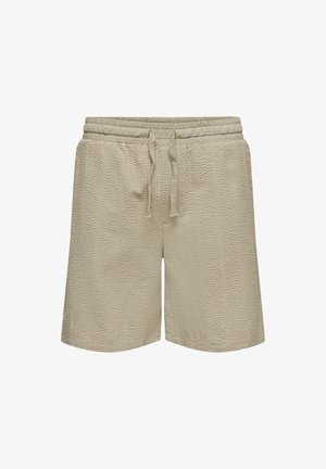 Beige textured knit shorts with elastic waistband and front drawstring, designed for casual wear.