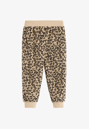 Lepardprint sweatpants med en lys beige bund, elastic waistband og manchetter. Blød tekstur med kontrasterende mørke pletter.