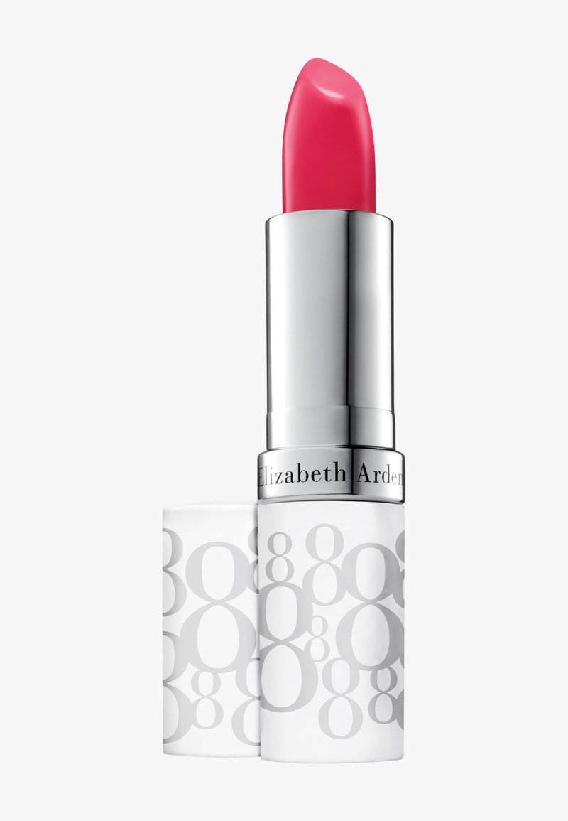 Rossetto rosa acceso in un tubetto argento e bianco con etichetta Elizabeth Arden, con tappo abbinato decorato accanto su uno sfondo chiaro e semplice.