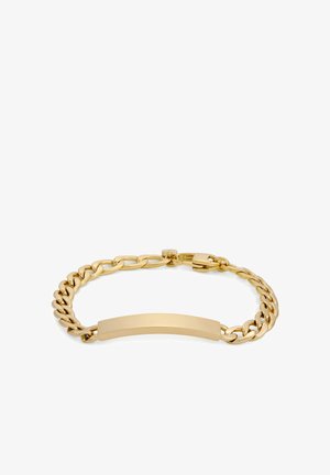 Bracelet en or avec un design de chaîne épaisse et un élément central lisse et plat. Le métal a une finition brillante et une fermeture à boucle sécurisée.