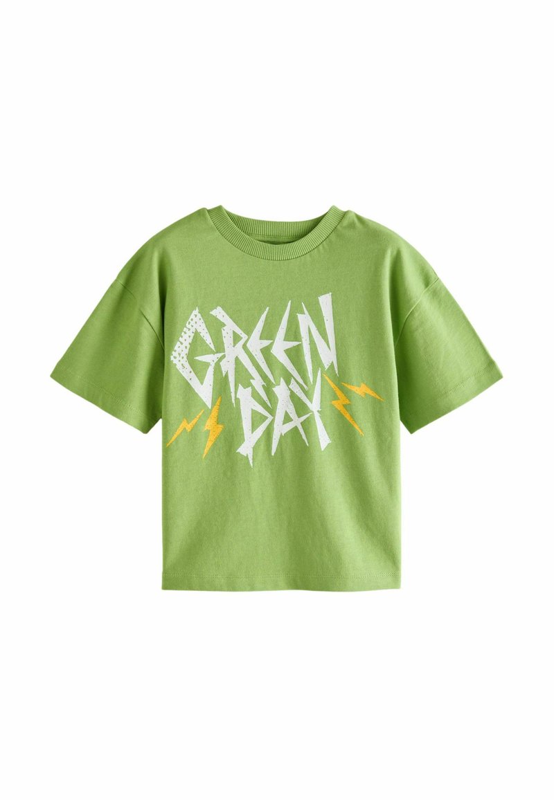 Grøn bomulds t-shirt med korte ærmer, prydet med "GREEN DAY" i hvide og gule lyn grafikker. Afslappet fit design.