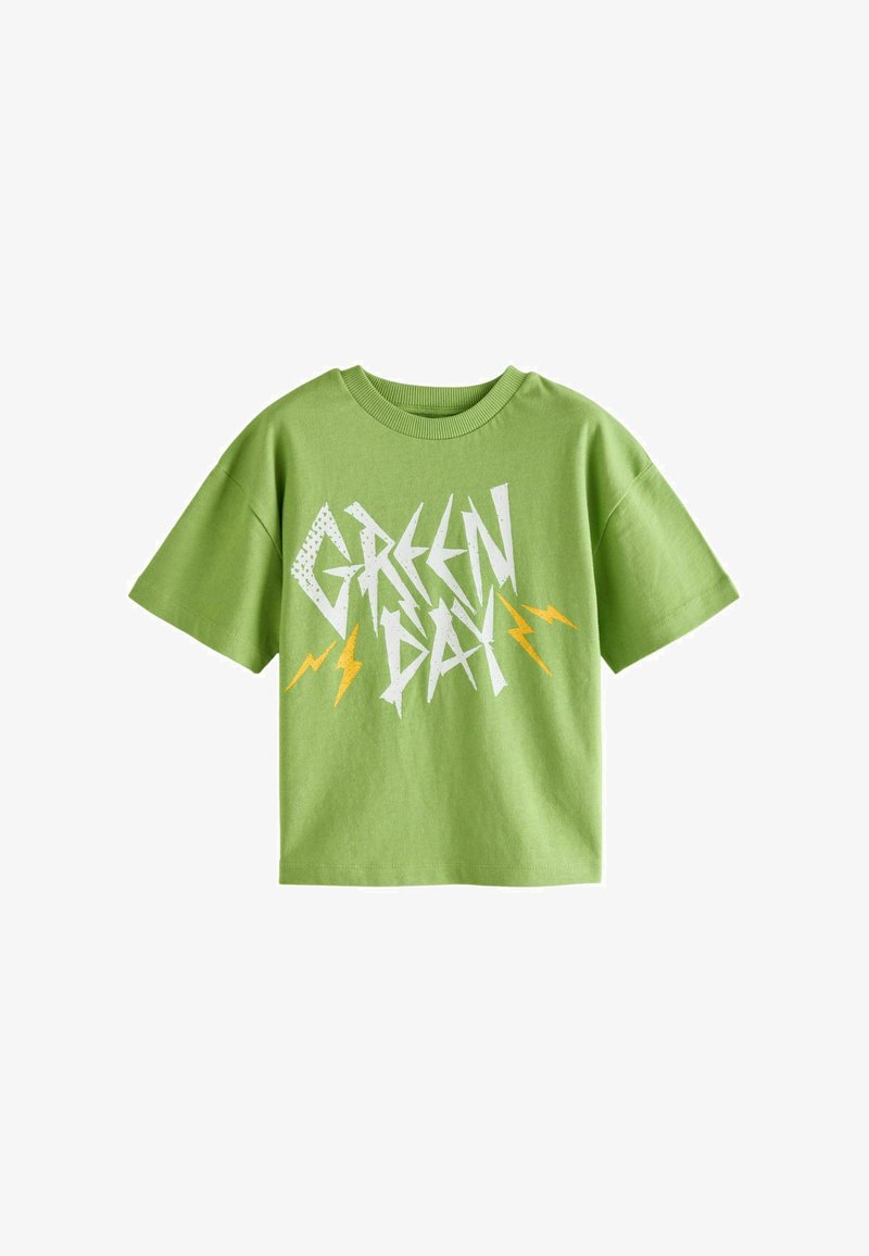 Grøn bomulds t-shirt med korte ærmer, prydet med "GREEN DAY" i hvide og gule lyn grafikker. Afslappet fit design.