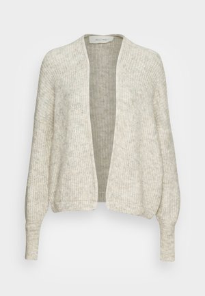 Cardigan ouvert beige clair avec un motif de tricot texturé, des manches longues et une coupe décontractée. Le tissu semble doux et légèrement transparent.
