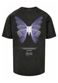 Black oversized t-shirt featuring a graphic of purple butterfly wings and text design on the back, with a round neck and short sleeves.