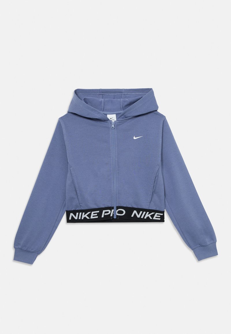 Veste à capuche courte en matériau polaire violet clair avec une taille élastique noire portant "NIKE PRO" en texte blanc, fermeture éclair à l'avant.