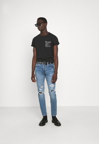 Levi's® 512™ SLIM TAPER - Calças de ganga justas - tabor crumble
