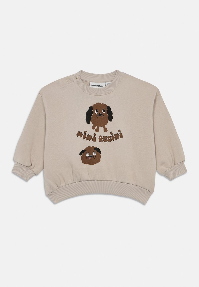 Sweatshirt bege cortada com decote redondo, mangas bufantes e dois botões de pressão. Apresenta duas impressões de cães cartoon em castanho e preto.