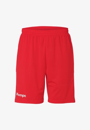 Røde sportsshorts lavet af letvægtsstof, med en elastisk talje og et hvidt "Kempa"-logo på venstre ben.