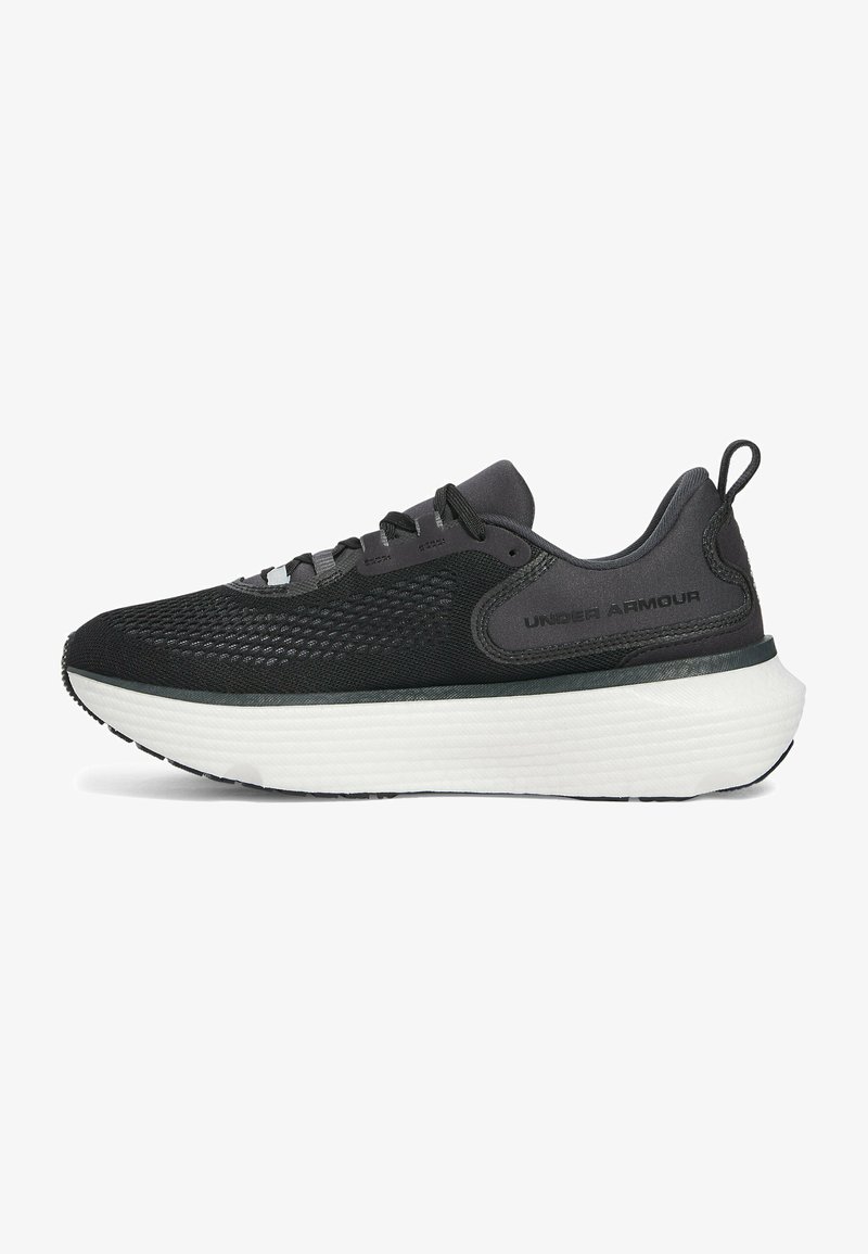 Black athletic sneaker with mesh upper, reflective accents, and a thick white foam sole, featuring traditional lacing and padded collar.