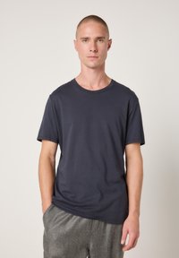 Dark navy short-sleeve t-shirt made of cotton, featuring a crew neck design and a relaxed fit with a smooth, soft texture.