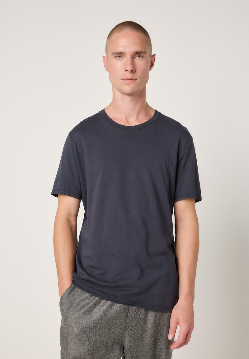 Dark navy short-sleeve t-shirt made of cotton, featuring a crew neck design and a relaxed fit with a smooth, soft texture.