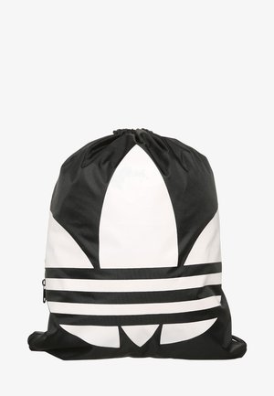Sac à dos à cordon noir et blanc arborant un grand logo trefoil Adidas sur le devant.