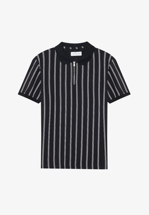 Polo noir avec des rayures verticales blanches, à manches courtes et col zippé. Fabriqué en tissu doux, avec un design épuré et structuré.