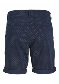 Shorts pour homme bleu marine avec un petit motif losange blanc, deux poches passepoilées à l'arrière et ourlets retroussés.