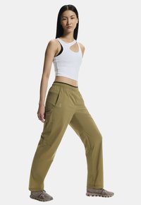 Leichte, olivgrüne Hosen mit elastischem Bund, Seitentaschen und lockerer Passform. Mit glattem Stoff und Nähte-Details.