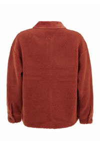 Red fleece jacket featuring a soft, textured exterior, a collar, and button closures at the cuffs for added detail and comfort.