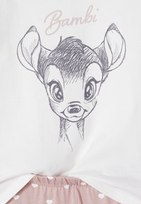 White top featuring a gray sketch of a deer, labeled "Bambi," paired with light pink bottoms adorned with white heart patterns.
