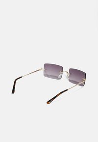 Square sunglasses with gradient dark gray lenses, gold metal frames, and tortoiseshell-accented temple arms. Lightweight design.