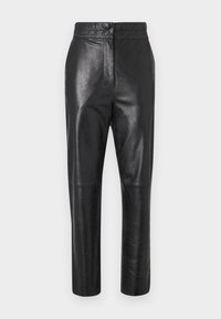 ANJI - Leather trousers - black