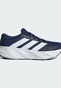 Navy blue running shoe with white sole and three white side stripes, featuring a textured midsole and mesh upper construction.