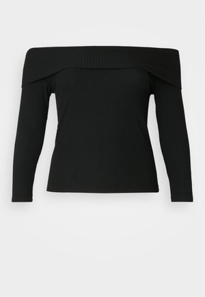 Svart ribbet topp med lange ermer og en avdemmet hals, med en teksturert stoff og en tettsittende design.